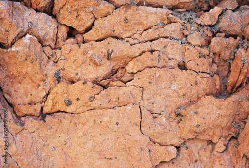 Demaged bricks and stone red orange surface grungy background