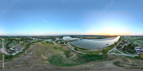 Canvas Print Aerial view at sunset capturing the Isola Serafini hydroelectric power plant wit