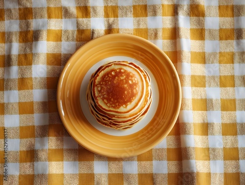 Glossy mustard enamel plate showcasing stacked pancakes invites brunch styling for delightful kitchen decor inspiration