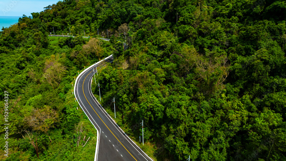 Fototapeta premium Aerial view of landscape view from flying drone in Nature as coastline of road way scenic view