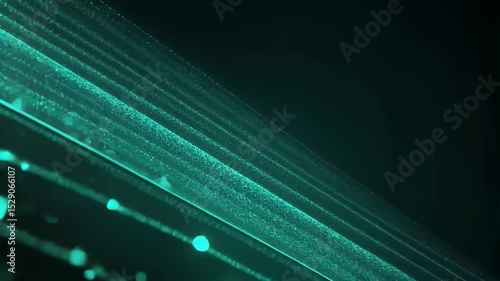 Abstract teal light streaks create a mesmerizing visual effect against a dark background.
