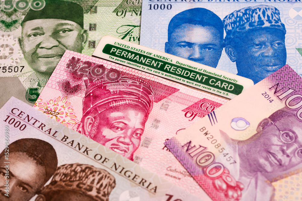 Fototapeta premium American Permanent Resident Card on Nigerian Naira