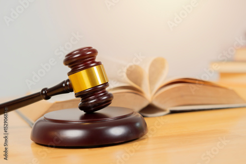 Divorce law, family law concepts. Court gavel ,ring and heart symbol on law book