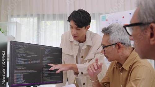 Asian Instructor Teaching Senior in Software Programming and Training Collaboration