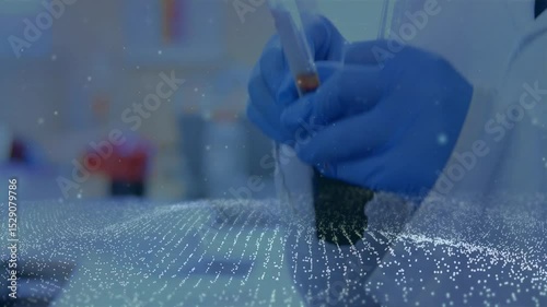 Gloved hand entering from right grabbing test tube, rotating inspecting sediment under mesh overlay