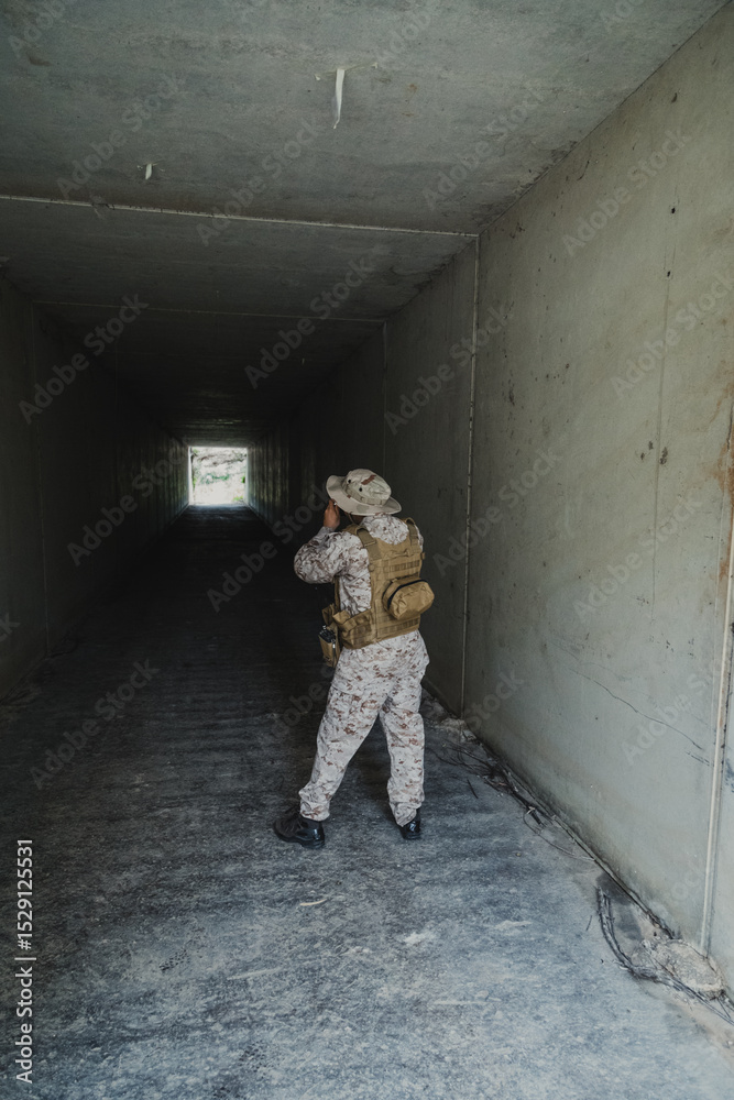 Fototapeta premium Soldier With A Camera Shooting Photos At The End Of The Tunnel