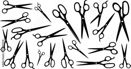 Black scissor silhouettes in different shapes, oriented in different directions, set on white

