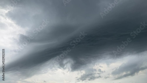Natural sky background with threatening dark grey clouds during stormy and rainy weather. Topics: storm, cloudscape, rain, meteorology, nature, air space, climate