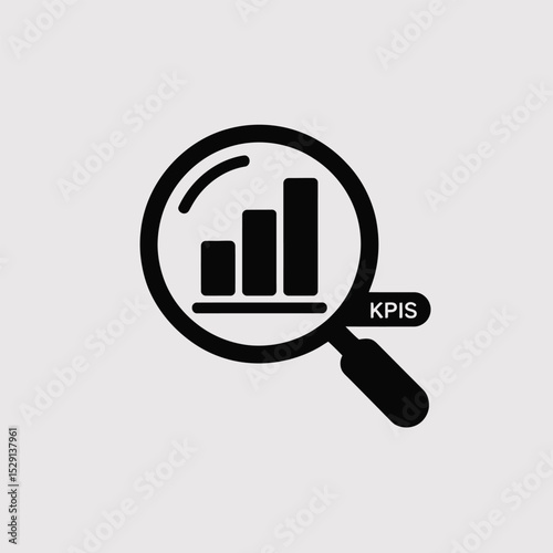 Magnifying glass analyzing bar graph showing kpis
