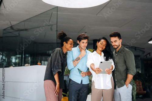 Group of busy happy diverse professional business team people working in office using digital tablet photo