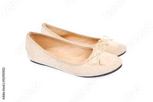 Pair of beige flat shoes isolated on white background. Elegant ballet flats.