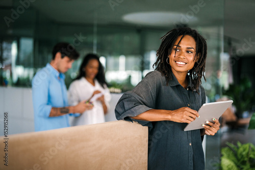 Fotografia Successful happy african american business woman, startup coworker or software p