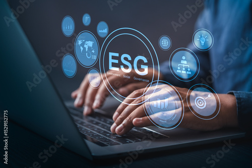ESG concept with business professional using laptop. Focus on sustainability, ethical governance, and responsible investment in a digital business environment.