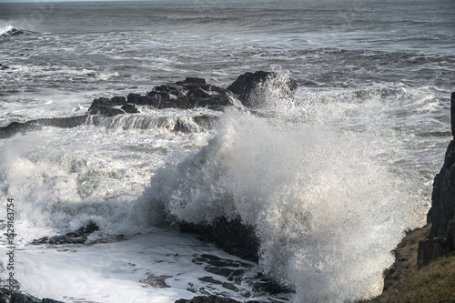 Fototapeta Naklejka Na Ścianę i Meble -  Powerful huge waves crashing on rocks in shoreline