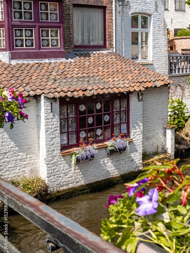 Obraz na plátně Bruges view, Canal-side house with flower boxes and lace curtains in Bruges, Bel