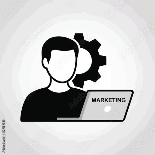 Marketing manager working on laptop with gear icon