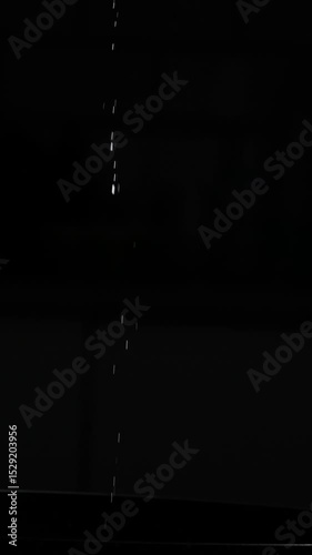 Slow-Motion Stream Of Cooking Oil Pours From An Oil Pitcher