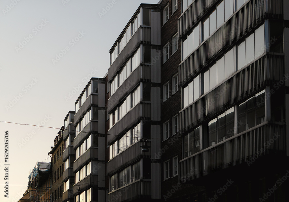 Obraz premium Low angle view of buildings in city during evening