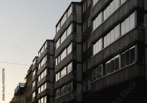Low angle view of buildings in city during evening