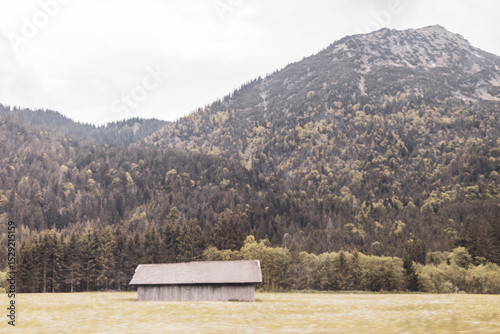 Alpine mountain hill landscape panorama with huts hut Tyrol Austria.