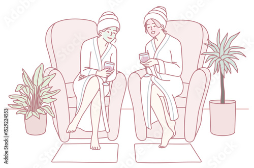 Two friends relax in cozy robes at a spa, enjoying a delightful pampering session with bright smiles