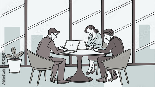Three business people work on laptops at a round table near a window in a modern office space setting