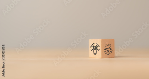 Creative idea generation for new product development concept. Creative thinking and innovation. Wooden block with product development icons, generating creative ideas,  market entry, commercialization