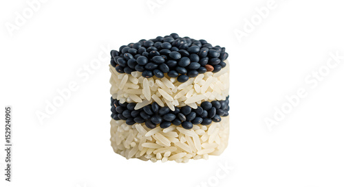 A visually striking arrangement of black lentils and white rice stacked in a cylindrical form, showcasing culinary creativity