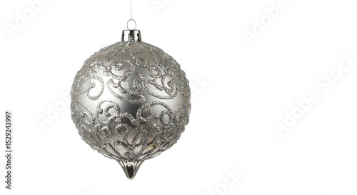 Ornate silver Christmas ornament hanging against a plain background, evoking festive spirit and holiday decor ideas