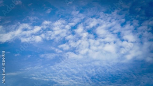 Time-lapse of clouds and blue sunny sky,  white clouds over blue sky, Aerial view,  nature, blue sky, white clear weather.