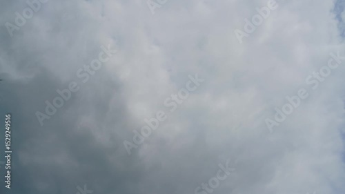 Time-lapse of clouds and blue sunny sky, white clouds over blue sky, Aerial view, nature, blue sky, white clear weather.
