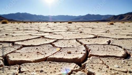 Cracked earth under the scorching sun, depicting a desert landscape