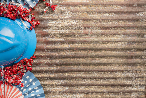 Labor Day holiday banner sign rusty tin background with red, white, and blue colors, hardhat, ribbons and stars, with plenty of copy space.