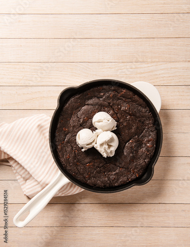 Pan of chocolate brownie with vanilla ice cream  photo