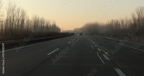 Highway driving view at dawn