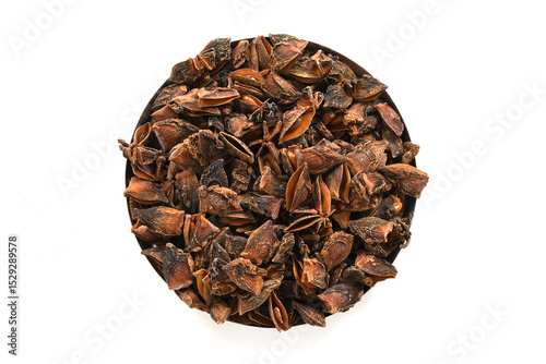 Whole Organic Star Anise. Aromatic Spice Closeup.Star Anise Pods. Natural Dried Spice on White Background. Star Anise Macro. Top View of Dried Star Anise. High-Resolution Stock Image.