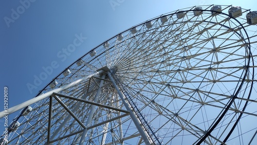 ferris wheel against blue sky
