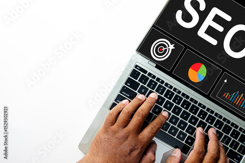 Top view of hands typing on a laptop with an SEO dashboard on screen. Concept for Search Engine Optimization strategy, data analysis, keyword research, and improving website ranking.