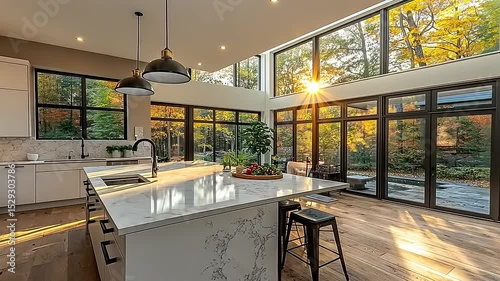 Sun-Drenched Modern Kitchen Interior with Expansive Windows Overlooking Autumn Forest Scenery
