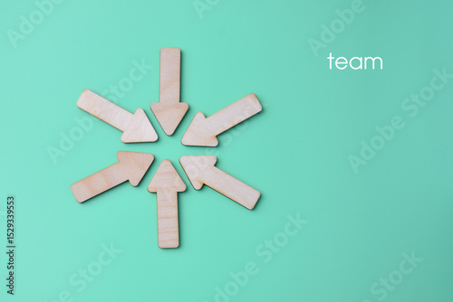 The arrows are pointing at a single point, a symbol of a team of people united by work and an idea