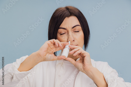 Photos Woman Using Nasal Spray for Health Relief