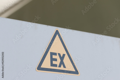 EX Warning Sign on Grey Surface