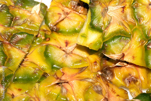 Close up of pieapple fruit skin on white background
