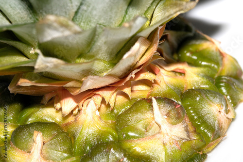 Close up of pieapple fruit skin on white background