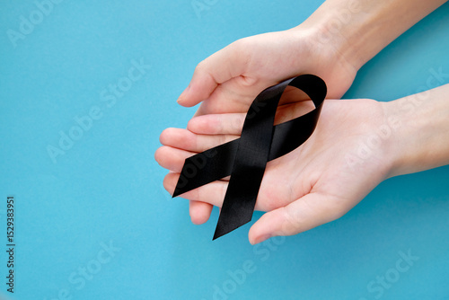 Black symbolic ribbon -  Melanoma problem