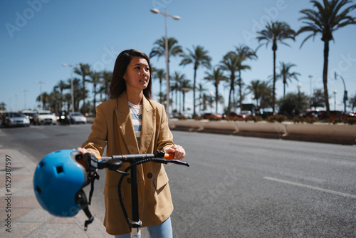Young woman using e scooter to explore town