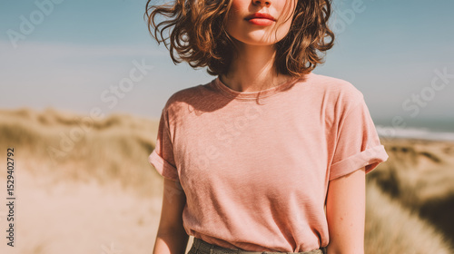 Young Woman Wearing Pink T Shirt Standing in Sandy Beach Environment
