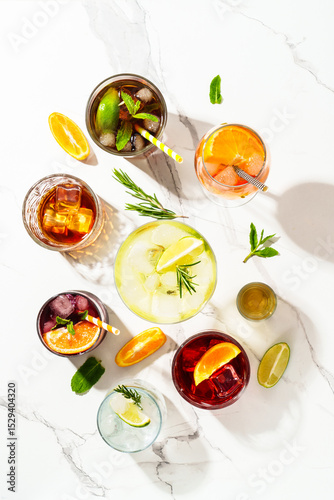 Alcohol cocktail drinks at white background.