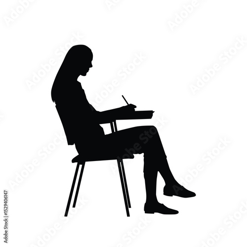 Silhouette of a Woman Writing While Sitting on a Writing Chair