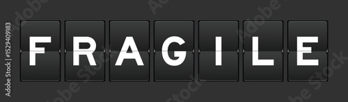 Black color analog flip board with word fragile on gray background